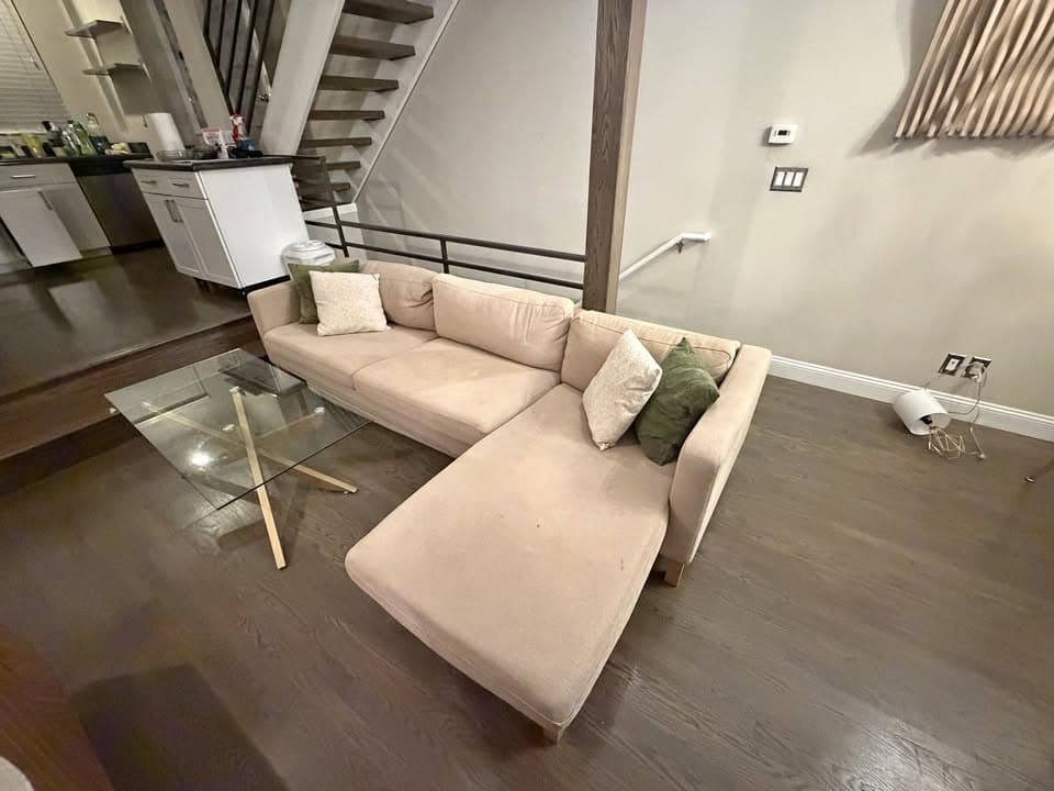 Real living-room source photo of a sofa