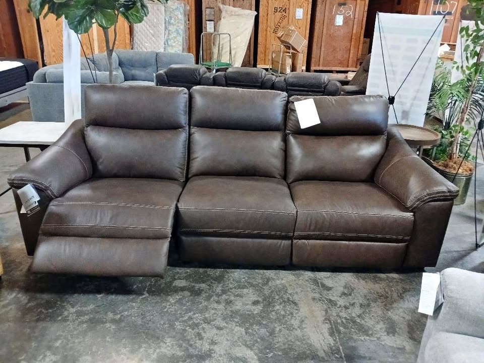 Original showroom photo of a brown reclining sofa